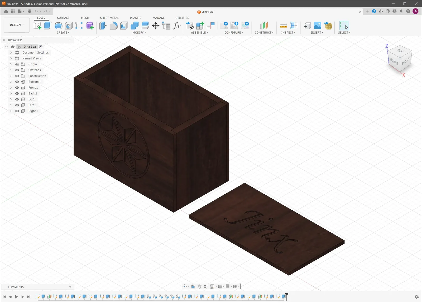 Computer drawing of a dark wooden box with a carved star on the front and a separate lid with Jinx carved in script.